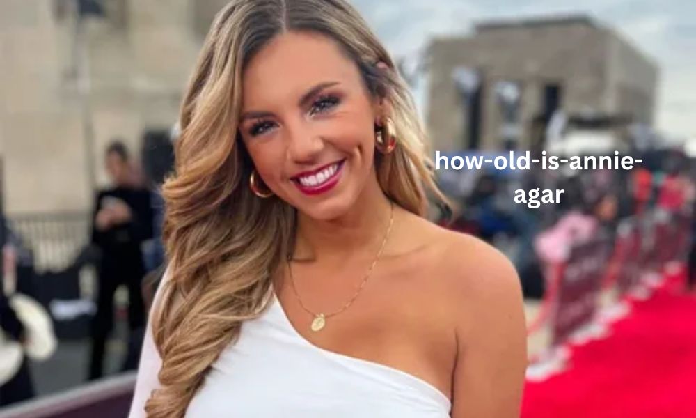 Annie Agar, a sports broadcaster and viral content creator, smiling for the camera. She is known for her comedic sports skits online.