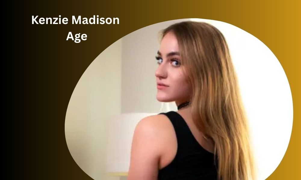 Kenzie Madison, adult film actress and director, posing for a professional headshot. She is a prominent figure in the industry.